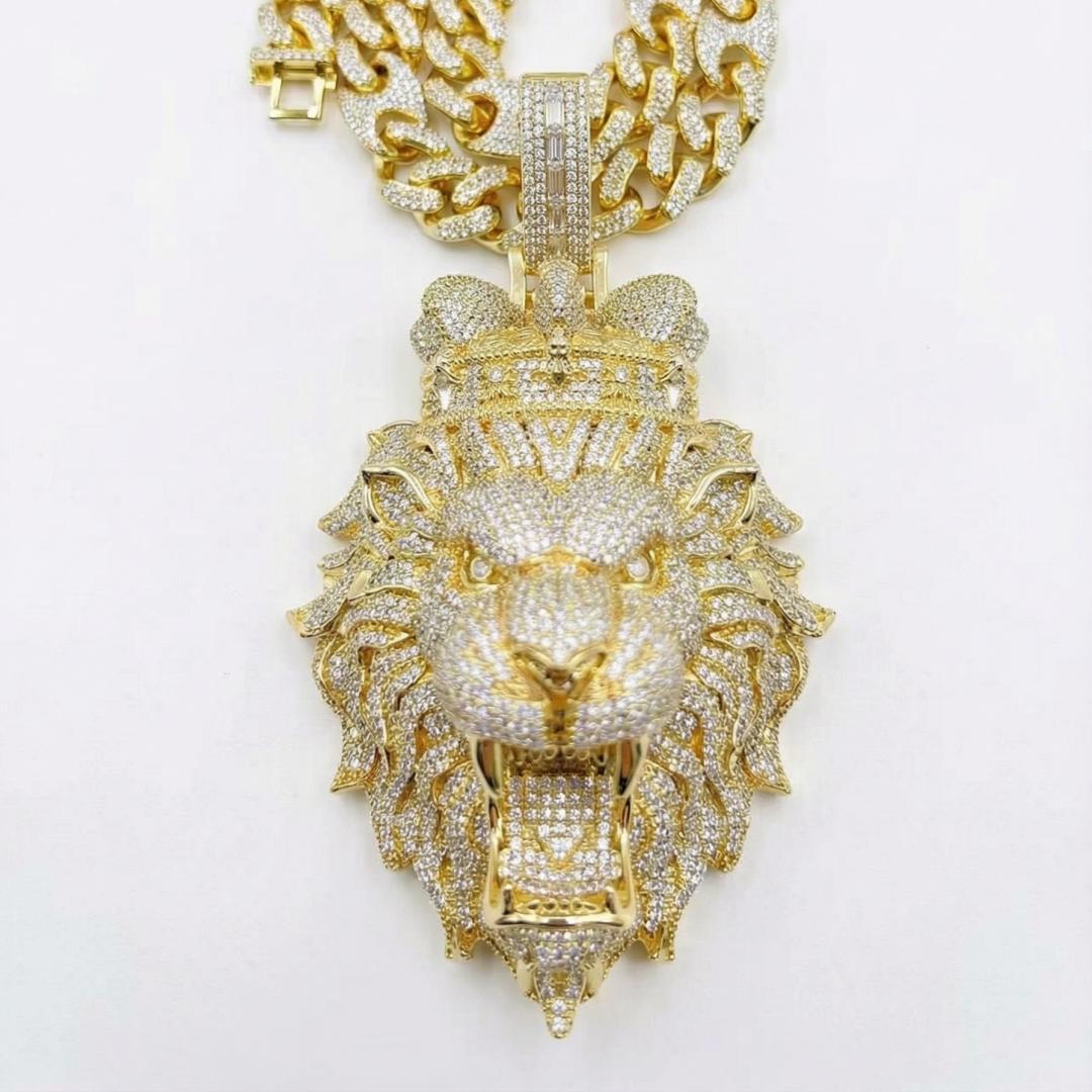 Detailed gold lion head pendant with iced out finish