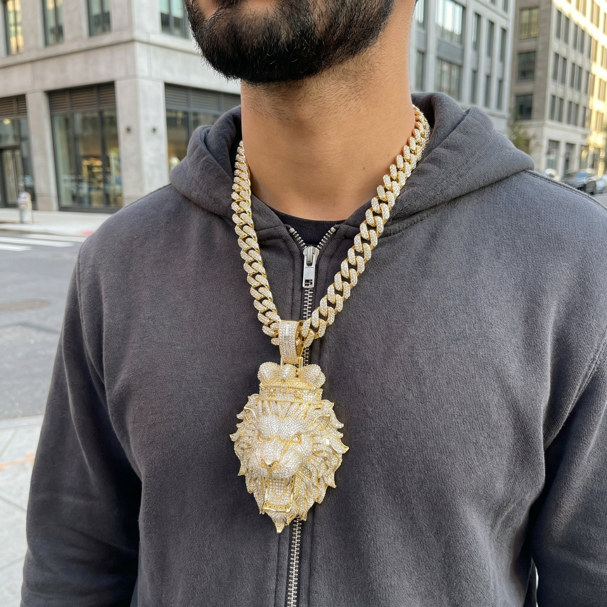Model wearing iced out lion head pendant necklace