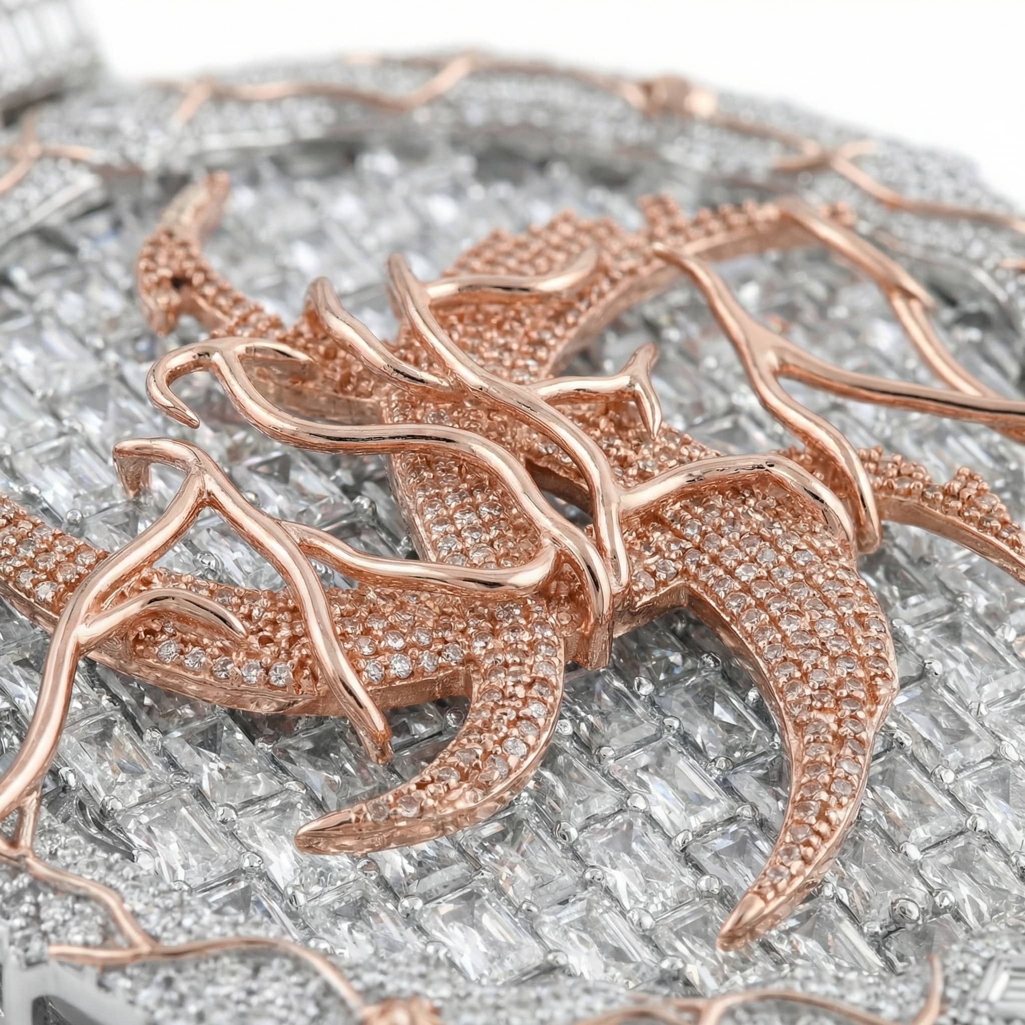 Close-up detail of iced out two-tone dragon pendant with CZ stones